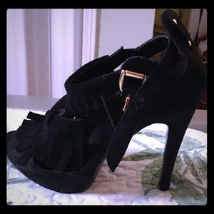 Black suede heels with tassels